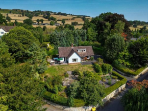 A spacious hidden gem with hot tub, lovely garden & views